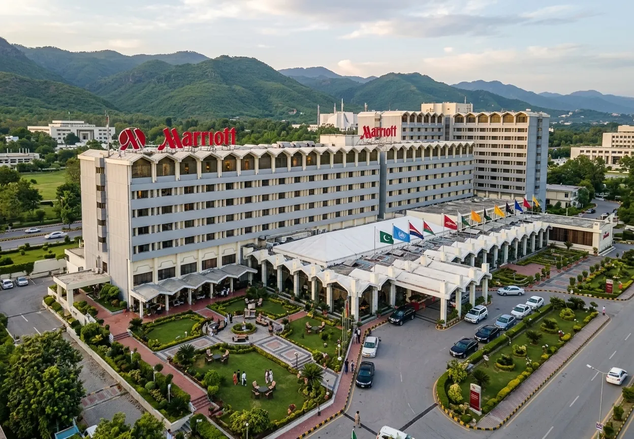 Islamabad Marriott Hotel and gardens with cars at the entrance